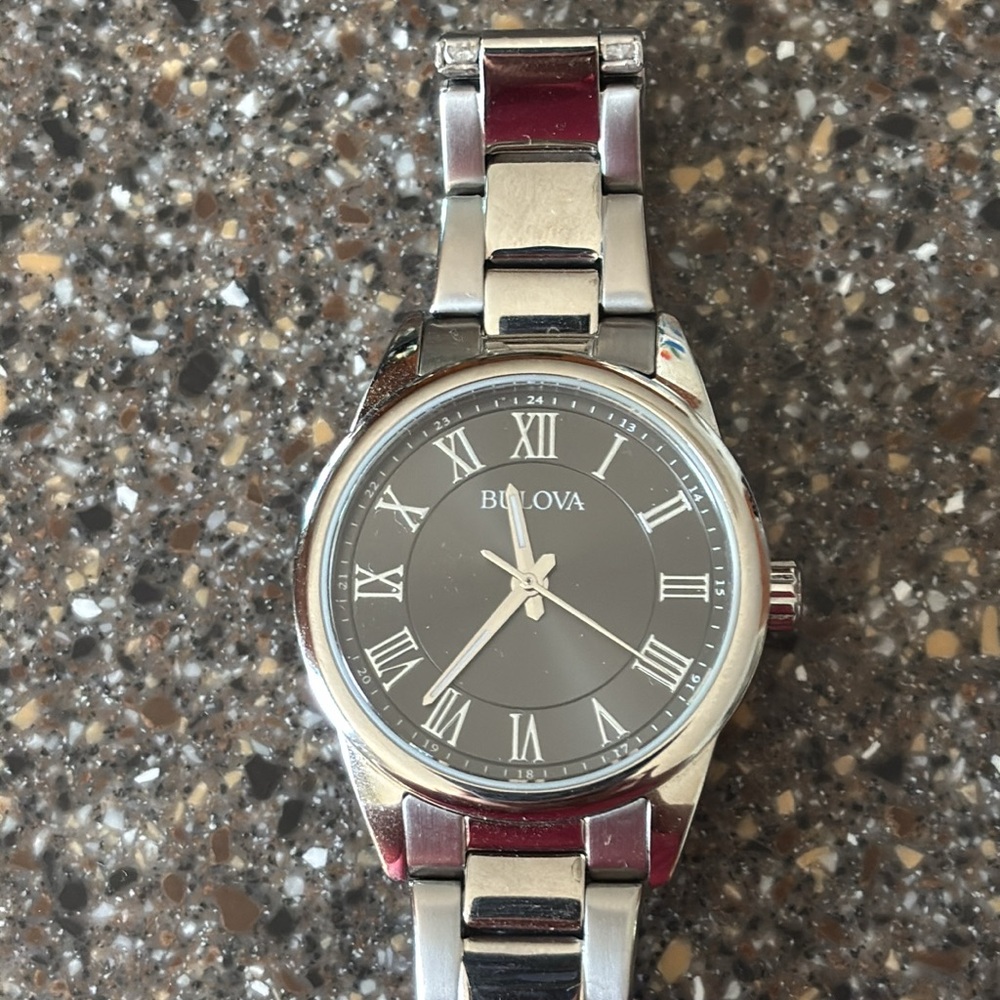 Bulova Silver Watch with Roman Numerals and Elegant Design